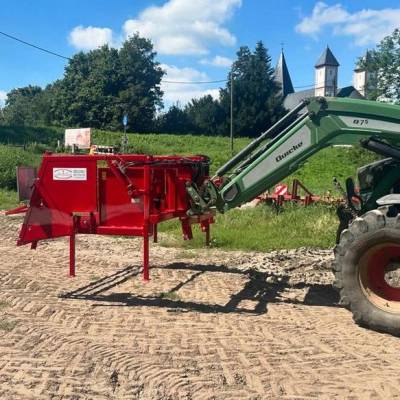 Wiesel 2400 attached to front loader, especially for winding greenhouse film